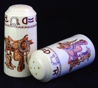 china western salt and pepper shakers printed with boots, saddle, brands & rope. Made in the USA