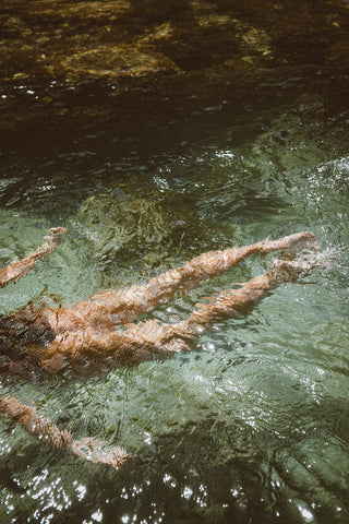 Akasha blends woman swimming river