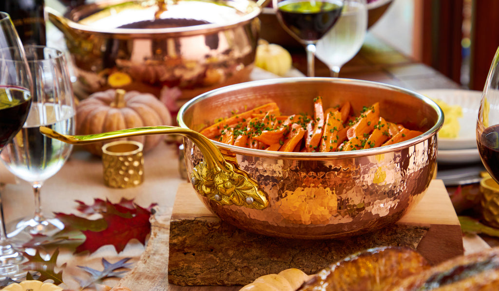 Thanksgiving table featuring Chef Owen Wyatt's glazed carrots prepared ad served in a Ruffoni Historia Chef Pan