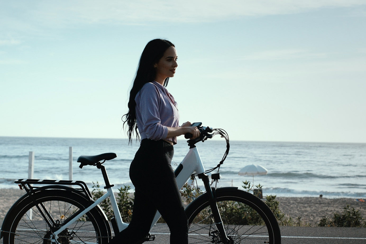 Woman at the beach with ebike