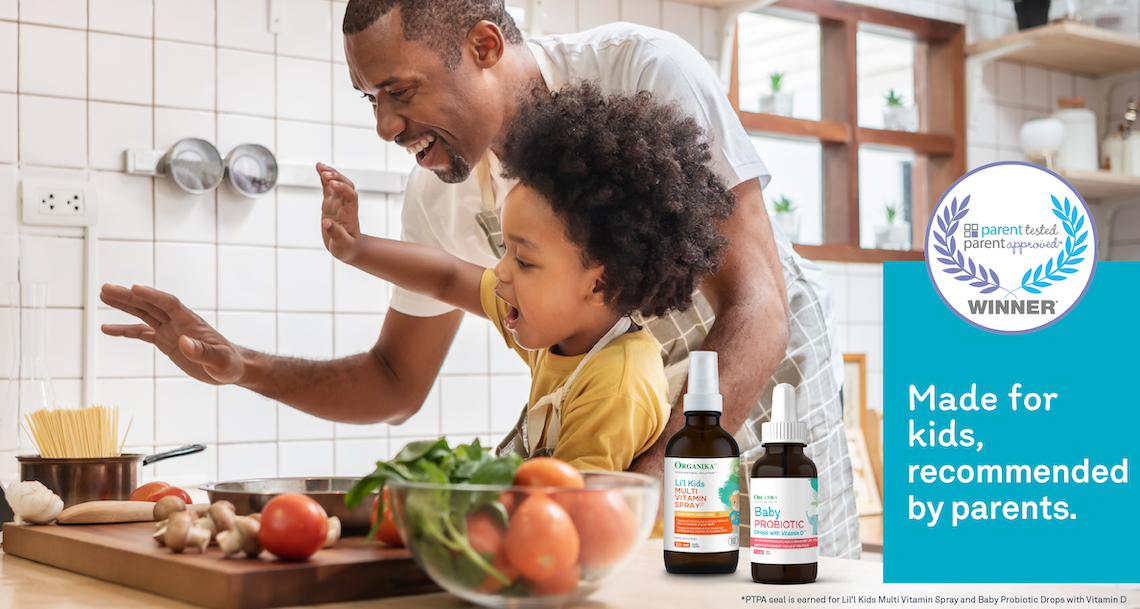 Parent and child cooking together and smiling