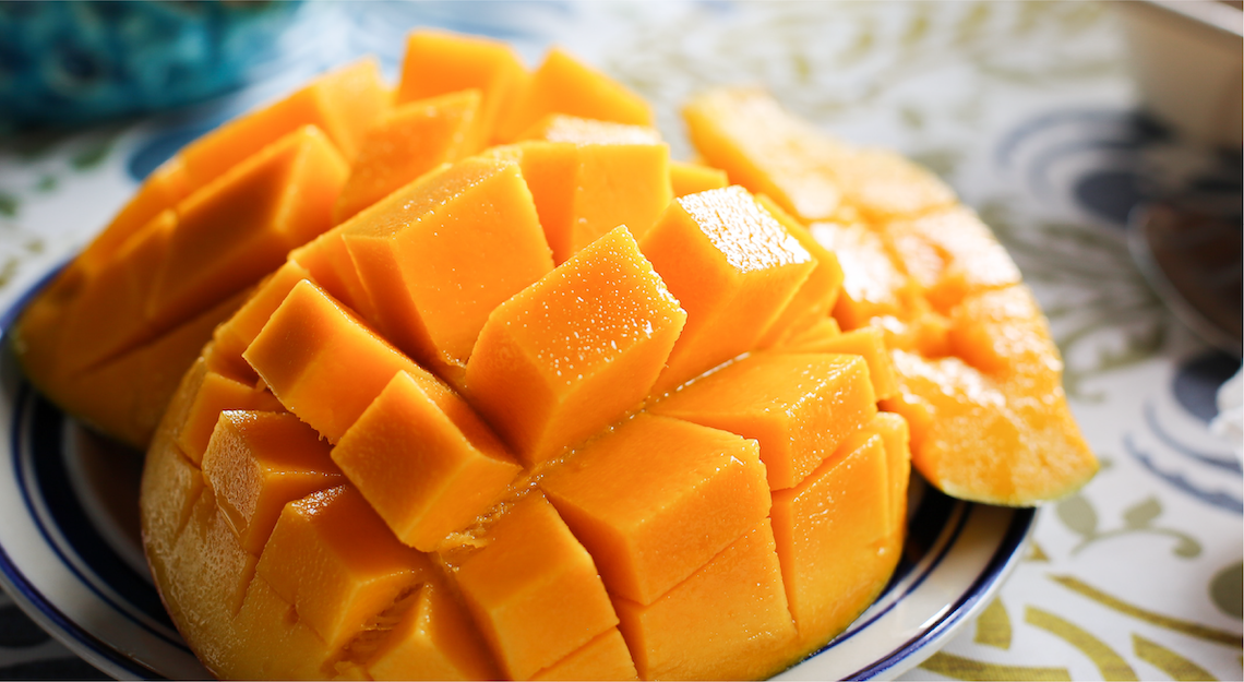 A mango cut and ready to eat