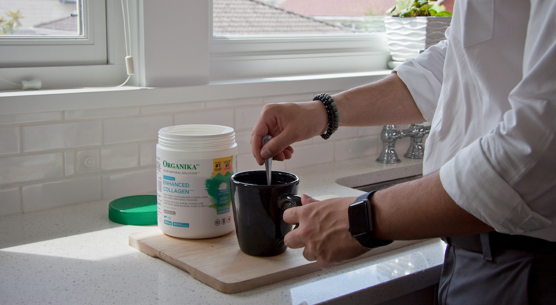 Man stirring Organika's Enhanced Collagen Original into a coffee