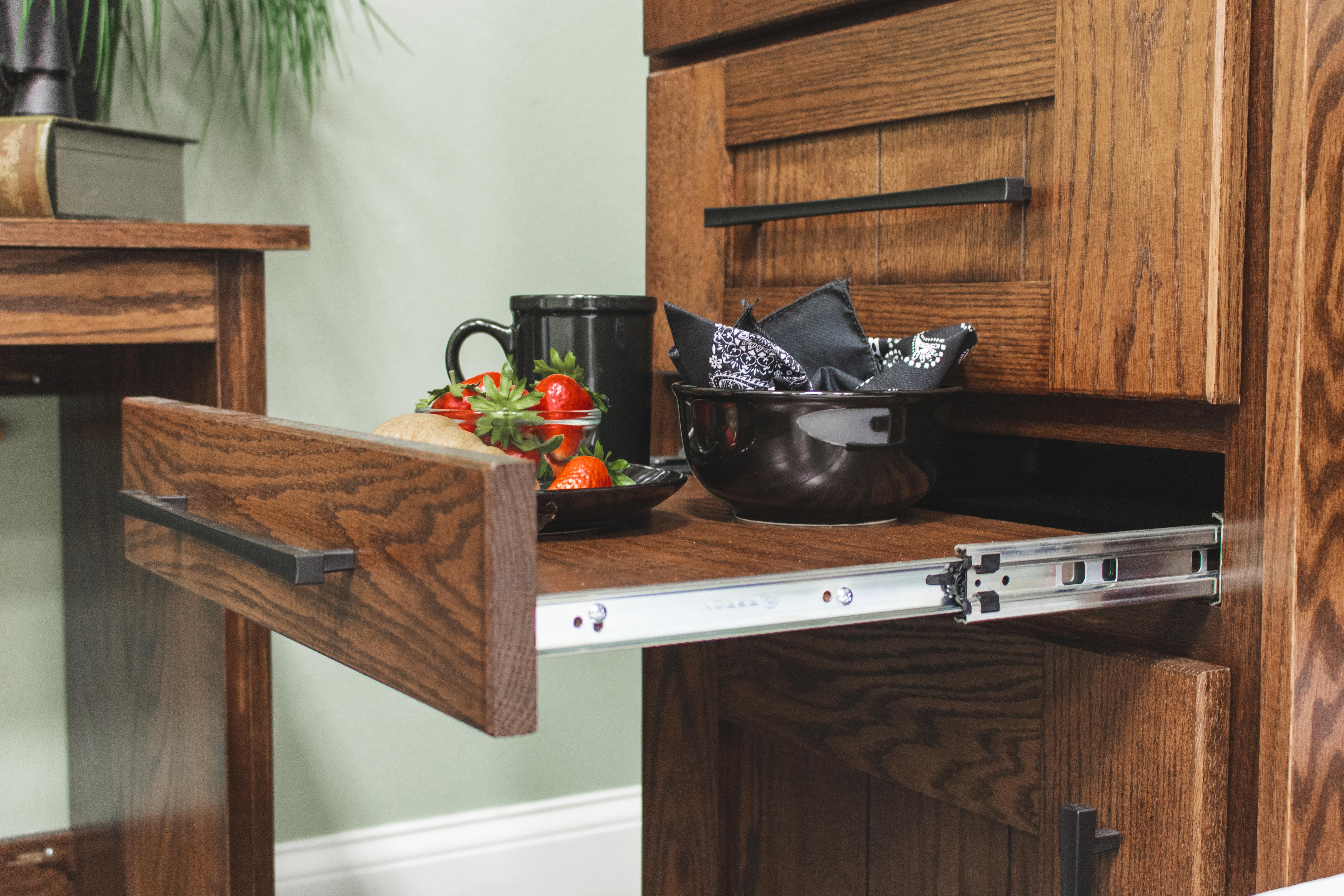 Pull-out nightstand on a side cabinet