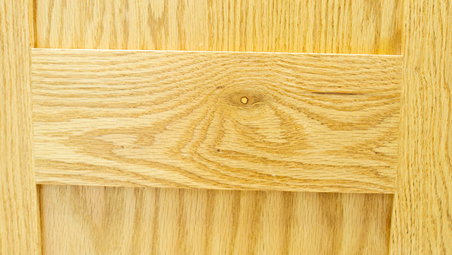 Wood knot on a bed face rail