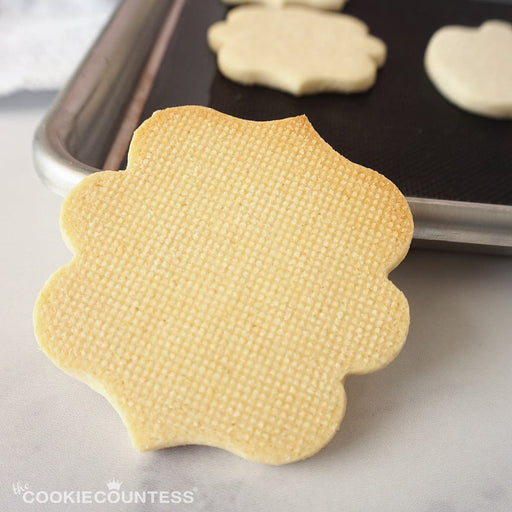 https://cdn.shopify.com/s/files/1/0355/7493/files/the-cookie-countess-supplies-mesh-non-stick-baking-mats-28255209979961_512x512.jpg?v=1686282664