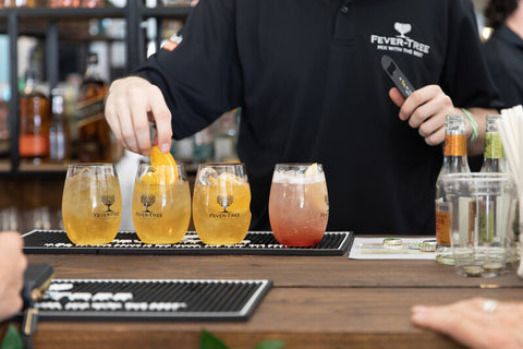 Different flavors of Fever-Tree in colored glasse by the bartender