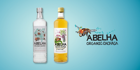 Abelha Organic Cachaça bottles with logo on display