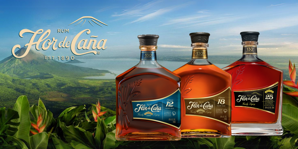 Flor de Caña rum bottles with Nicaragua hills and coast in the background