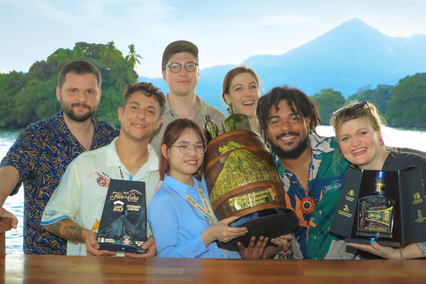 Group photo with Julie Nguyen Champion holding the prize at the Sustainable Cocktail Challenge Flor de Cana
