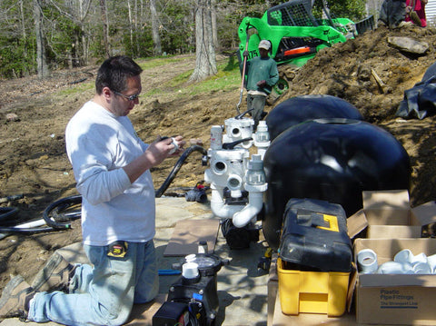 John Bianchi Working on  A filtration system near the pond