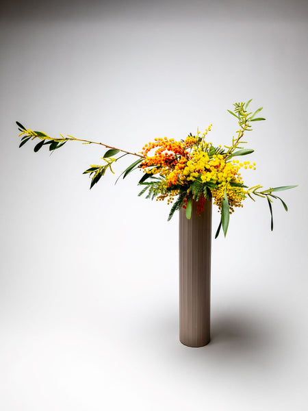 Horizontal Ikebana set with orange and yellow flowers