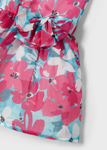 Turqoise and pink floral girl's dress .mayoral 3917 girl's dress. Party dress for a girl in turquoise and pink floral fabric. Detail.