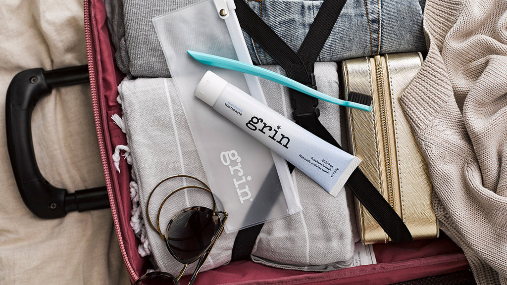 grin natural on the go travel kit toothpaste with flouride biodegracable toothbrush