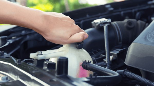 A hand tighting Coolant Overflow Tanks