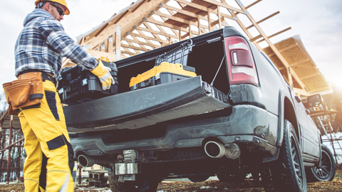 a man put the pickup tool box for truck into the car