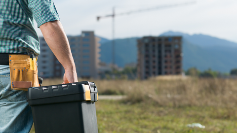 A man carrying pickup tool box