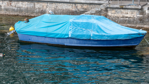 A boat with Waterproof and sun protection Boat Cover