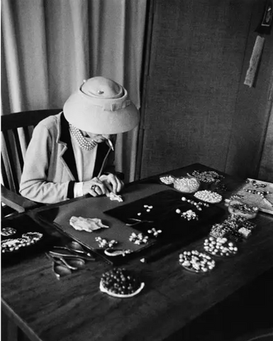 Coco Chanel working at her desk