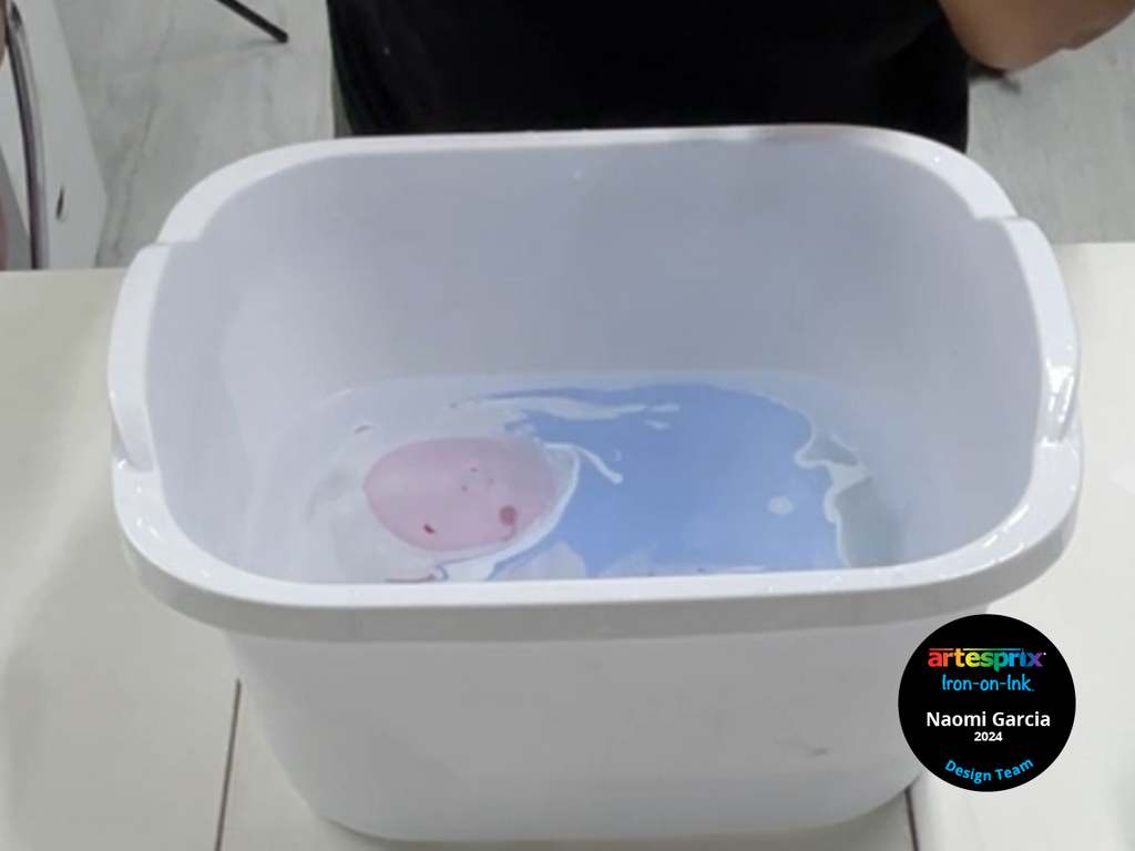 dish soap in water in a bin