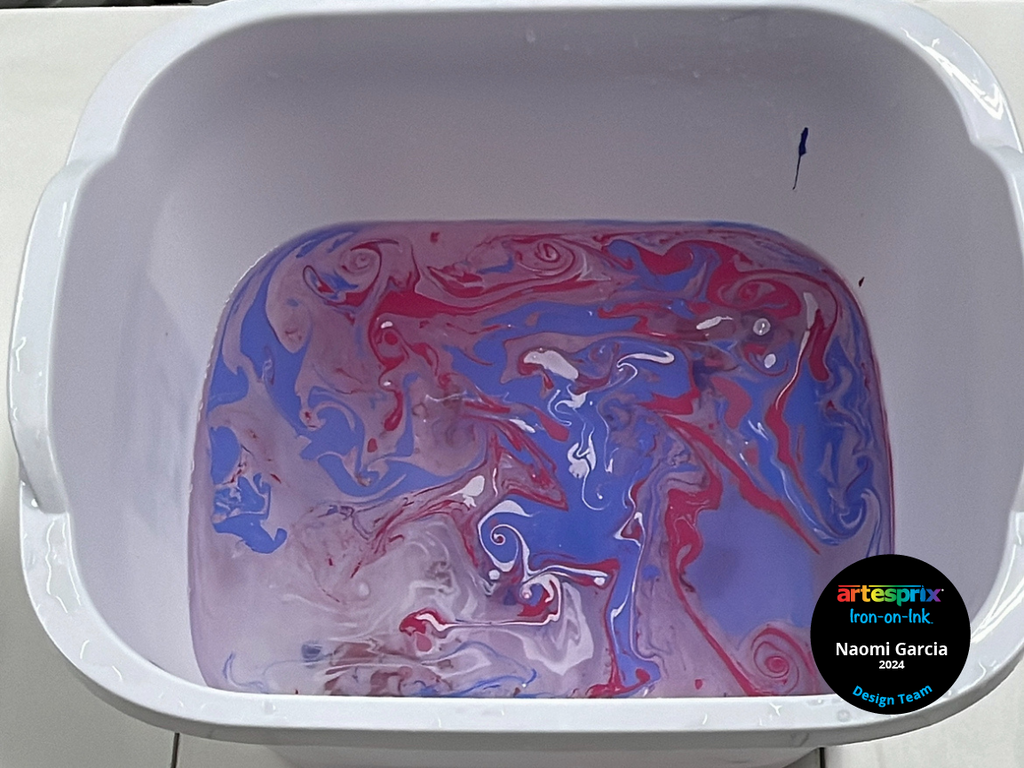 sublimation paint in dish soap water in a bin