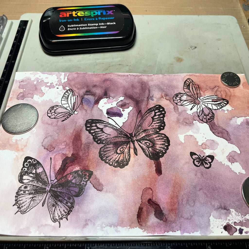 butterfly stamps with black iron-on-ink on watercolor transfer