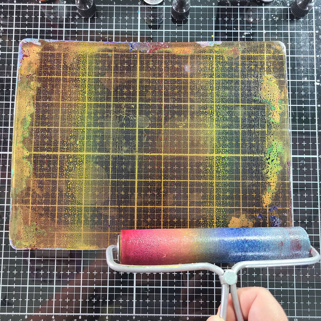 brayer with artesprix ink on gel press plate 