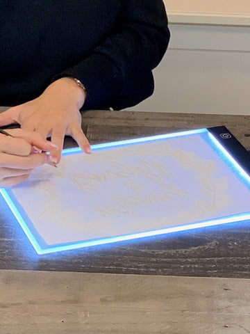 Trace your design on regular copy paper using a light box