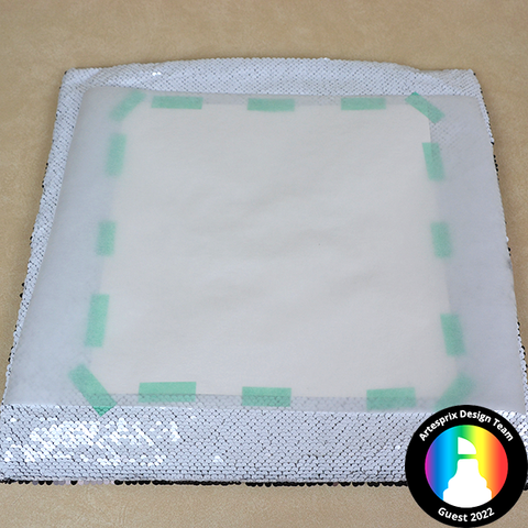 secured sublimation design to sequin pillow with heat tape 