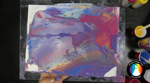 sublimation paint poured onto watercolor paper 