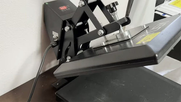 Plug in and switch on the heat press machine