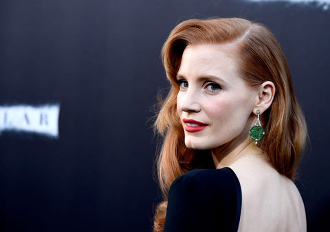 actress Jessica Chastain attends the 2014 Hollywood premiere of Interstellar wearing a pair of finely carved jadeite earrings