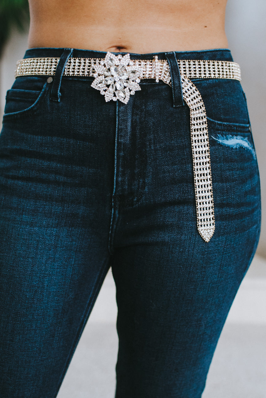 bling brooch on blue jeans as deco