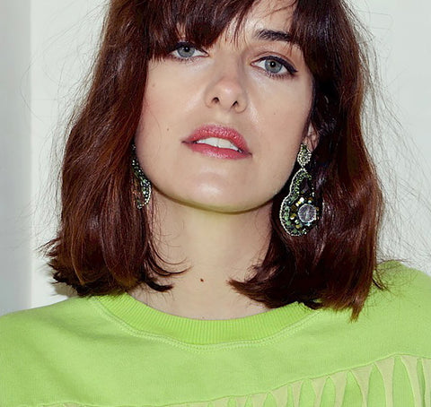 Sustainability Influencer Marie Nasemann wearing green handmade statement earrings as GNTM jewellery