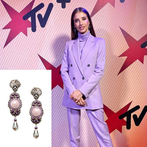 Cathy Hummels wearing purple Maschalina statement earrings