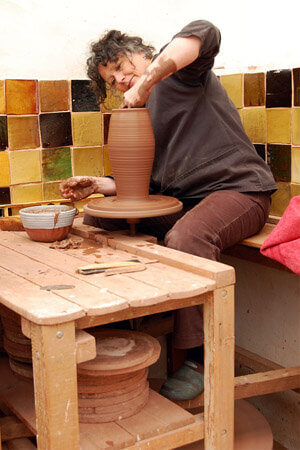 Carole Glover ceramics artist, at the wheel.