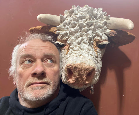 Garry Jones posing for a selfie with his handmade ceramic bulls head