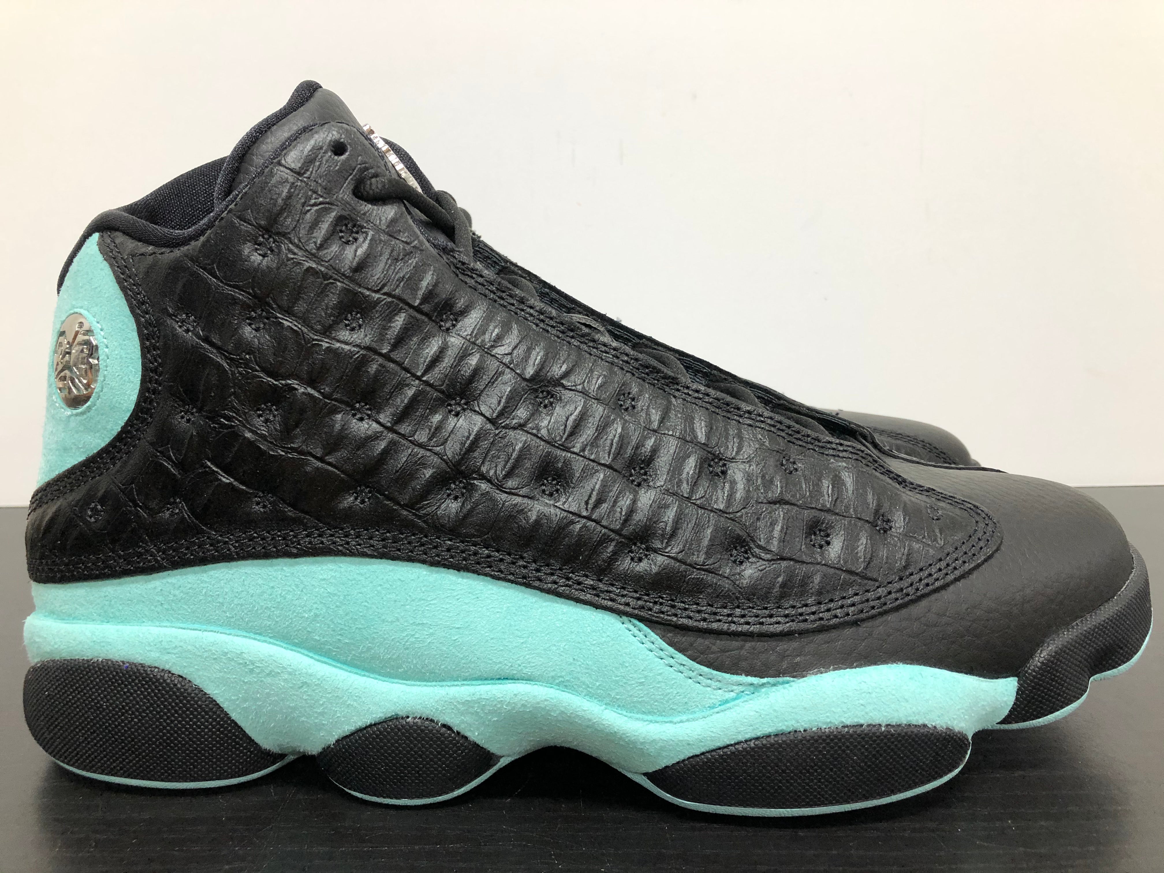 black and turquoise jordan 13