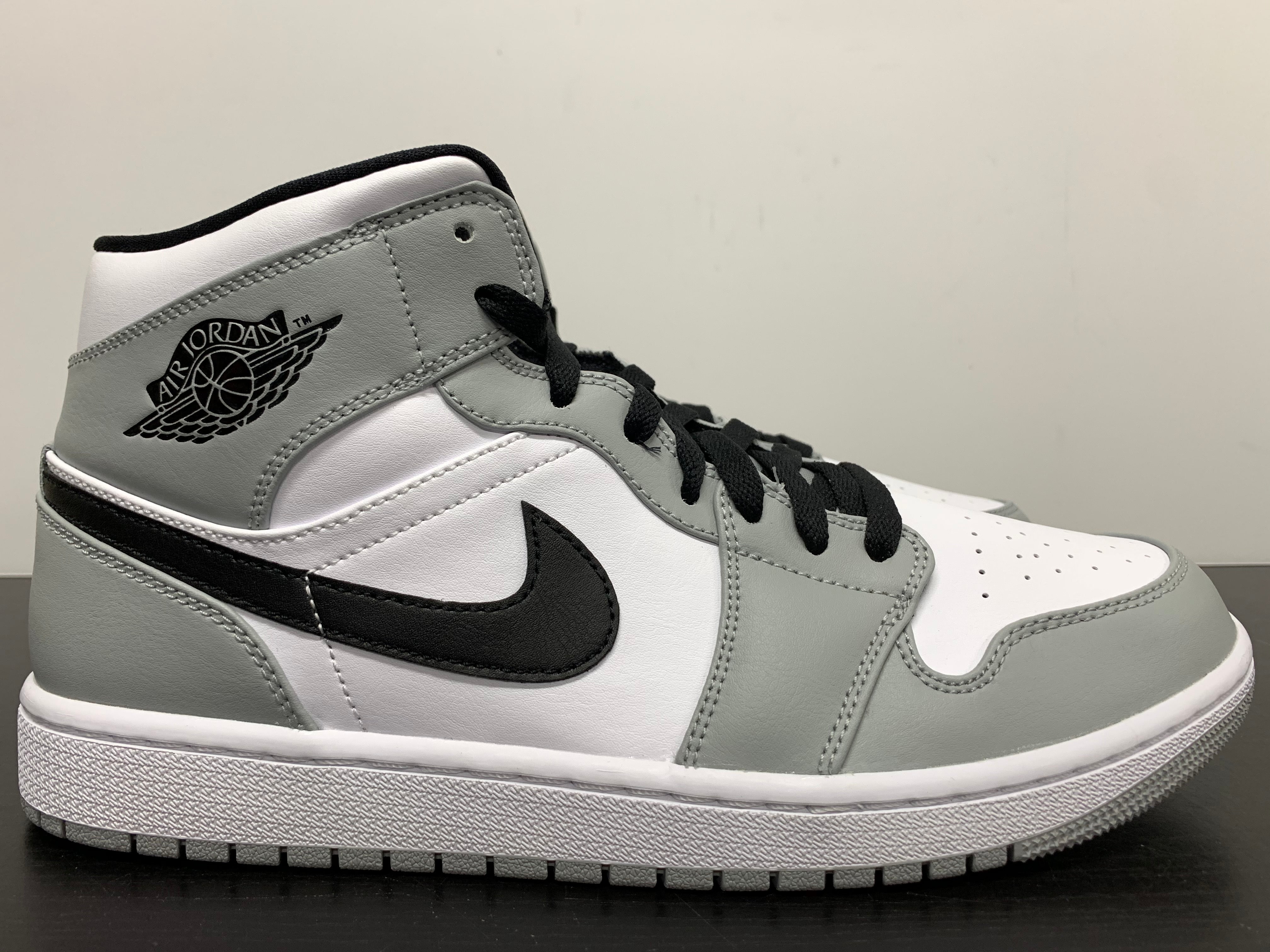 grey jordan 1s mid