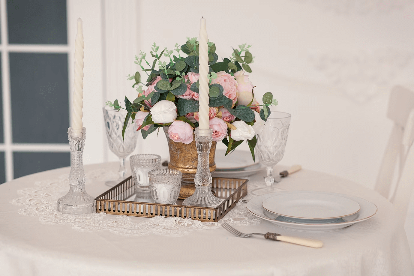 fake flowers and candle holders centerpieces