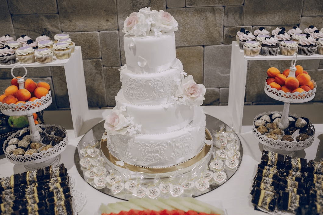 wedding cake stand with cake and dessert