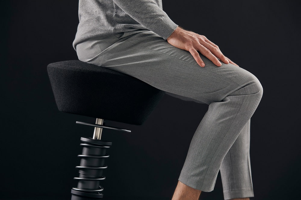 Aeris Swopper office stool allows dynamic ergonomic sitting without backrest.