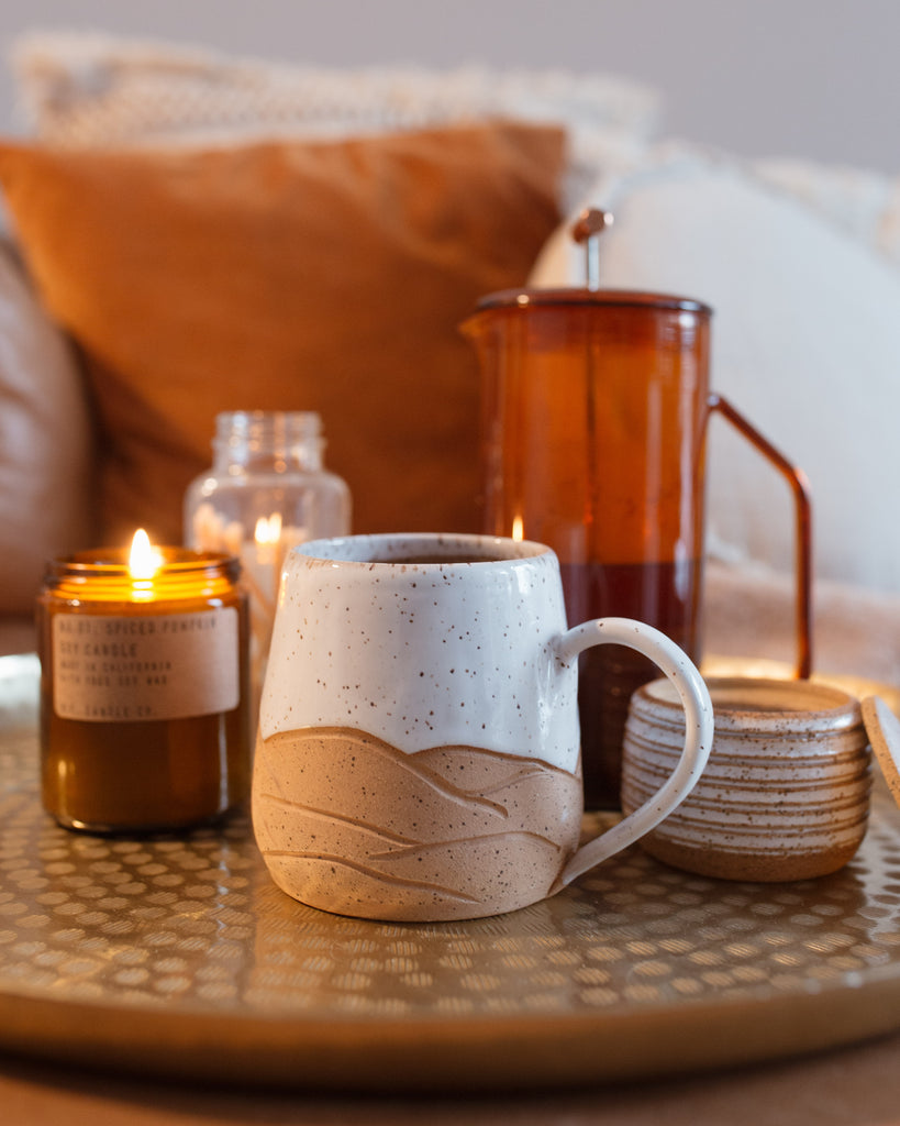 Coffee and candles on a table