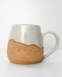 Handmade Mug with mountains carved in it