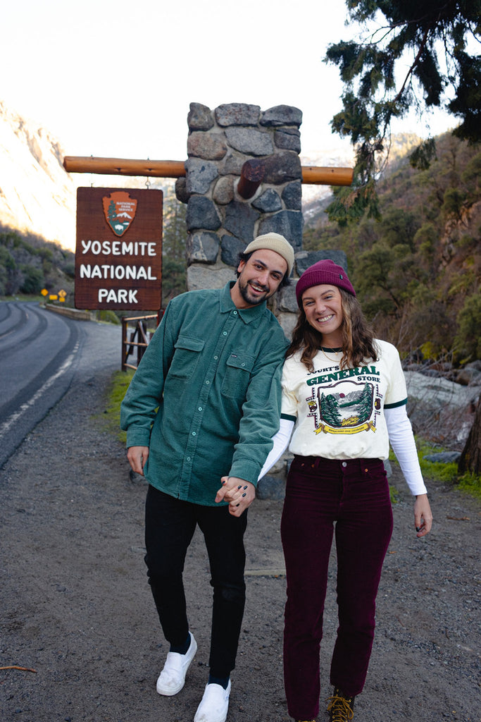 Emma and partner in front of Yosemite sign