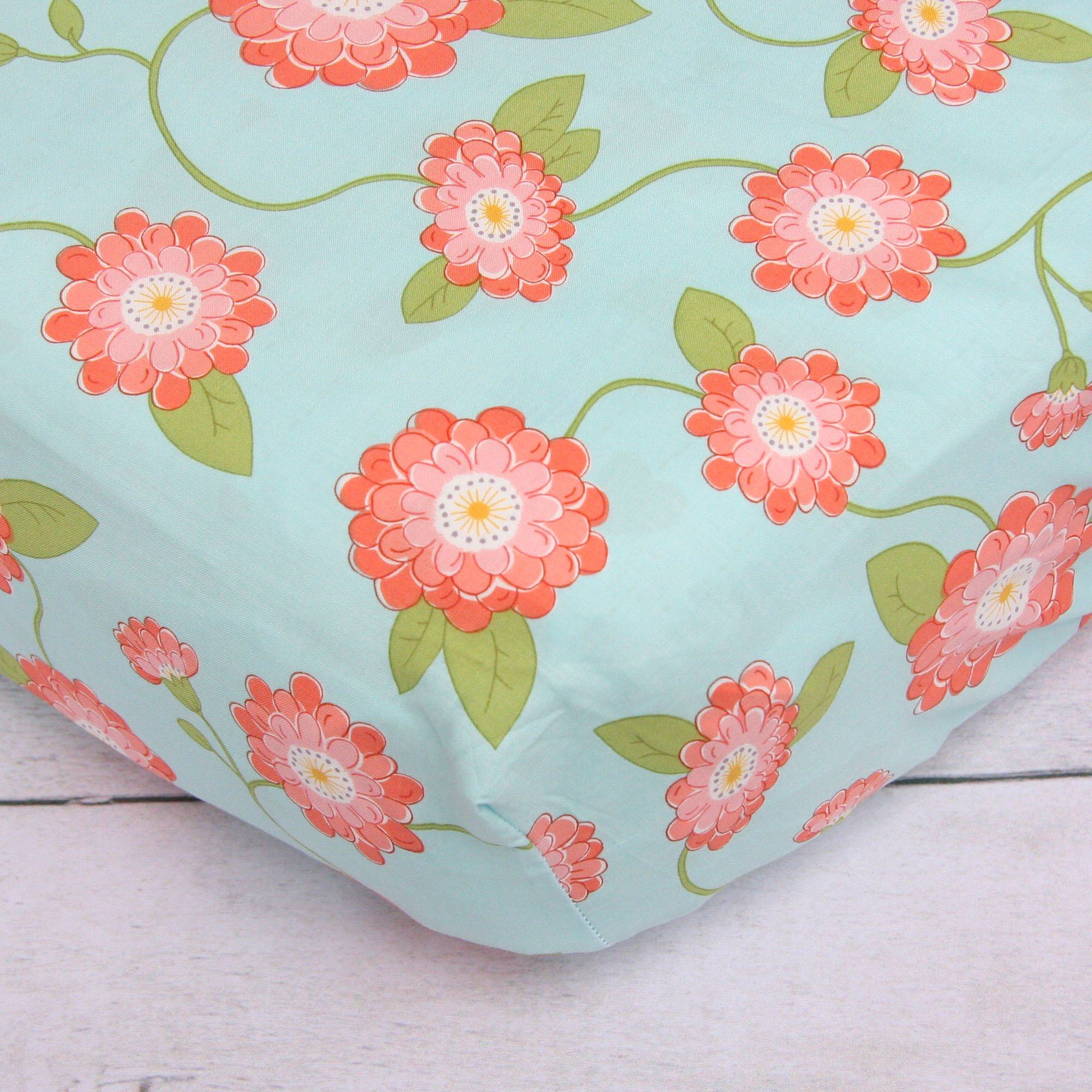 coral and teal floral crib bedding