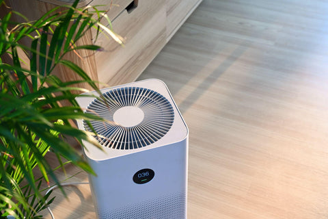 Air purifier on wooden floor in comfortable home.