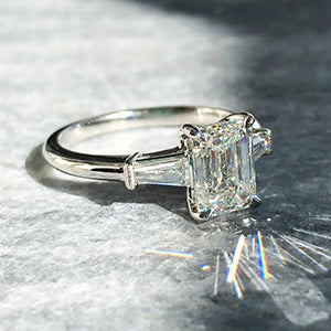 emerald cut diamond engagement ring with tapered baguette sidestones