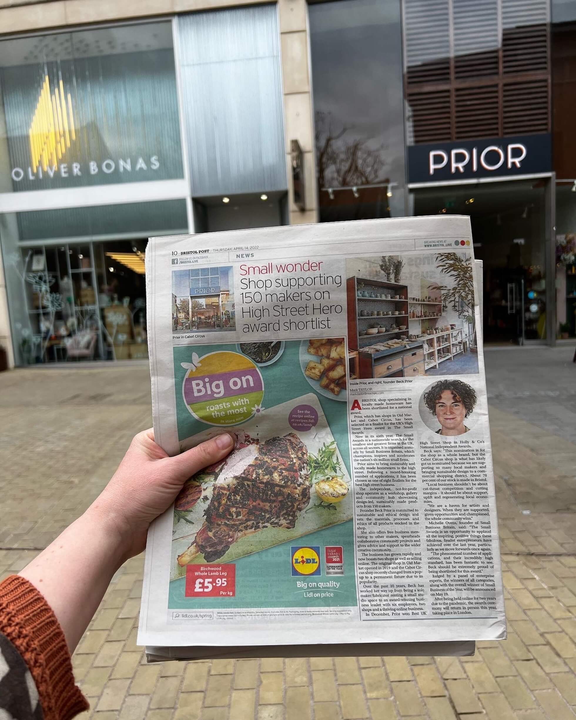picture of a hand holding a local bristol newspaper