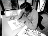 black and white portrait of maker in his studio.